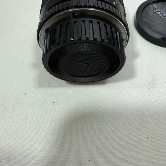 Yashica Zoom Lens 42- 75mm with case & Hakuba uv 55mm lens